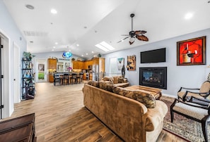 Inviting main living room featuring a smart TV & access to a balcony