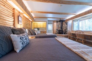 Enjoy this charming studio with kitchenette, two queen beds, smart TV, and a full bath