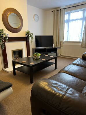 Cosy home from home lounge with reclining sofa