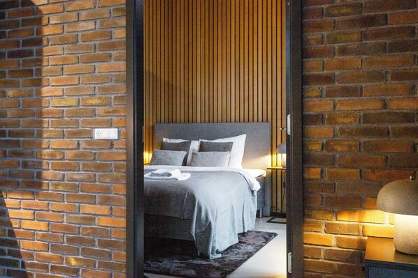 Super stylish master bedroom with huge built-in closet and direct access to private balcony just above the canal