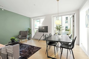 Living and dining area with the cool painted wall