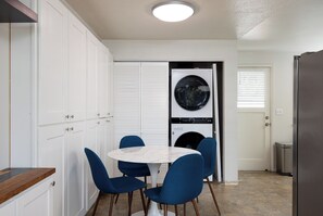 Dining table and laundry machine