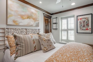 Soft sheets, a cozy queen bed, and easy access to a bath.