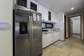 Fridge with ice maker and filtered water dispenser.