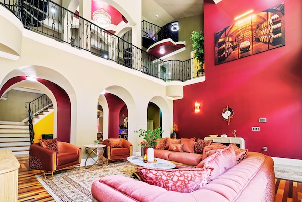 Welcome to Maya's Bluegrass Resort! Step into this beautifully renovated 7500 sq ft home with soaring ceilings, vibrant colors, and an open-concept design that creates the perfect space for both relaxation and stylish entertaining.