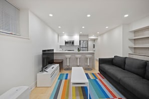 Everything you need, all in one stylish space—this thoughtfully designed studio makes relaxing, dining, and unwinding feel effortless