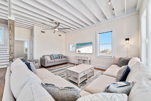 Large living area with tons of natural light pouring in