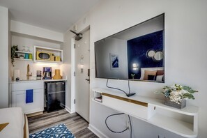 Elegant kitchenette with modern essentials—your perfect getaway spot!