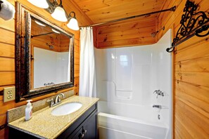 A private bathroom that beckons a hot shower or a warm soak in the tub.