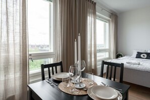 While dining, you have a view of the kitchen and the city of Tampere. If you wish, you can also dine on the cosy balcony.