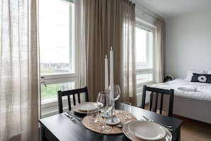 While dining, you have a view of the kitchen and the city of Tampere. If you wish, you can also dine on the cosy balcony.