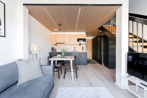 Apartment kitchen with a dishwasher, oven, stovetop and a microwave