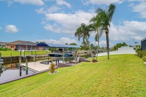 Backyard | Canal Access On-Site | Private Dock | Waterfront Patio