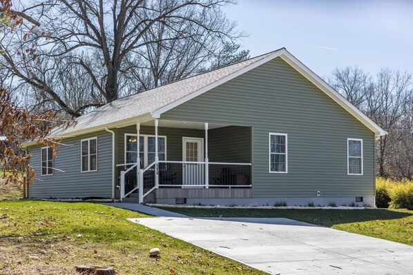 A charming home with a welcoming porch, perfect for a peaceful getaway