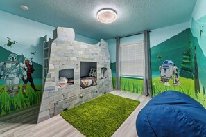 Let your young Padawans embark on galactic adventures in this amazing Star Wars themed bunk room! Perfect for creating unforgettable vacation memories.