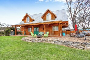 Front side of the cabin with fire pit.