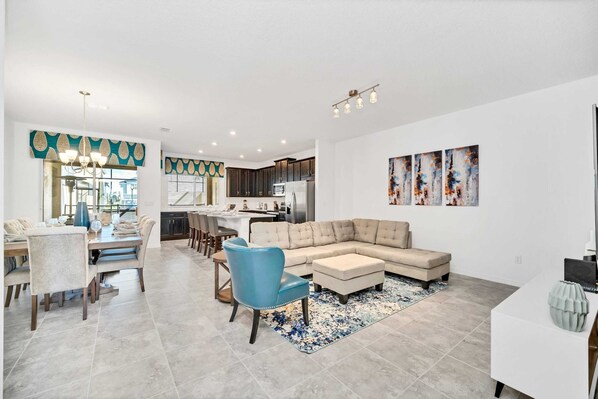 Large Dining Table Adjacent To The Open Living Room