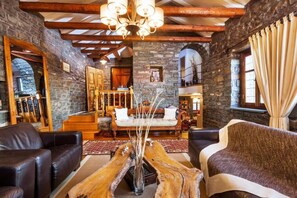 Relax and unwind by the fireplace, surrounded by unique decor and a cozy ambiance