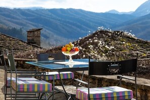 Relax on the patio and enjoy the serene beauty of the surrounding landscape, day or night.