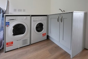 Utility room with washing machine and dryer.