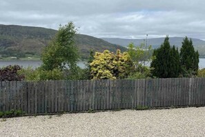 Front garden overlooking hills and loch.