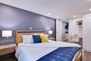 Bedroom with A/C, curtains, work station, TV and access to private bathroom + jacuzzi in the rear patio. 