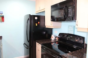 The kitchen is well-stocked with everything you need to make a delicious meal.