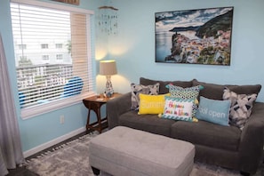 The colorful and bright living room is just perfect! There is a smart TV provided so you can stream all of your favorite movies and TV shows during your stay.