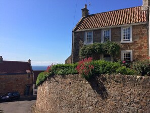 The cottage from Shoregate, the lane to the harbour and beach
