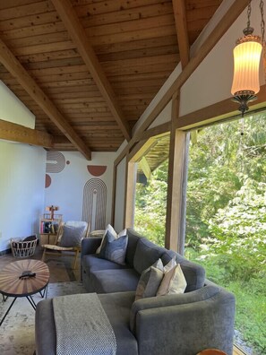 Spacious living room with ocean views. The couch is a queen pullout.