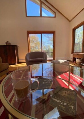 Enjoy your cup of coffee on the couch overlooking the garden.
