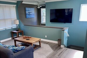 Spacious Living Area with Large Screen TV