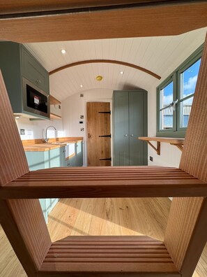 Towards the bathroom through the beautiful kitchen