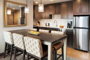 Separate dining area and partial kitchen.