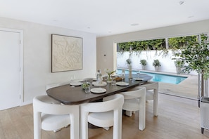 Enjoy the best of indoor-outdoor living with large doors that open directly from the dining area to the pool.