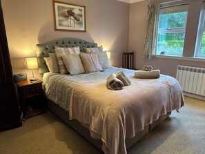 King size bed in large main bedroom 