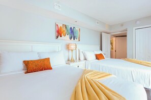 Bright, colorful, and cozy—this cheerful bedroom features two comfy beds, fresh linens, and vibrant decor. Perfect for families or friends looking to unwind and recharge during their Myrtle Beach vacation!
