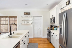 Kitchen: Modern appliances meet stylish design for culinary adventures!