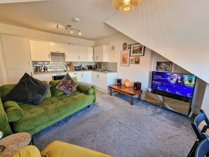 Relax with family and friends in our living room, watch your favourite films and series on our Smart TV