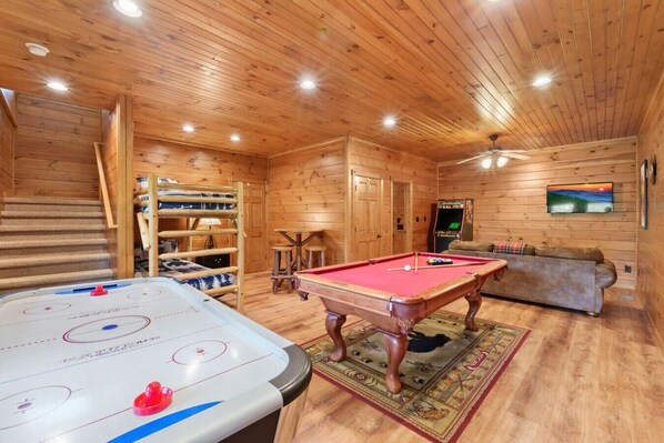 From tournaments to movie nights, this large lower-level game room delivers with every amenity for relaxation and recreation.