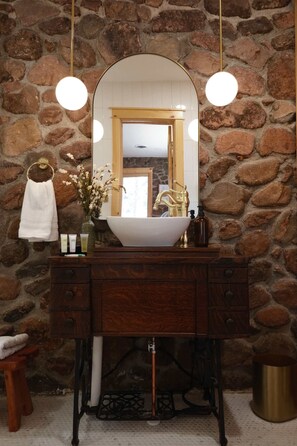 Craftsman bathroom with vintage sewing machine vanity.