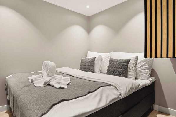 Soft, neutral tones create a serene atmosphere in this inviting bedroom.