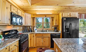 Fully stocked kitchen with full size appliances