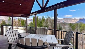 Enjoy outdoor relaxation on the deck with plenty of seating and beautiful views