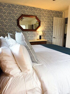 The bedroom with a king size bed