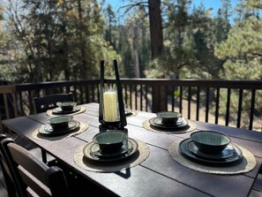 Dine under the stars on our serene wooden deck, surrounded by nature's beauty.