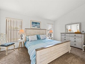 Elegant Master King Bedroom with a luxurious En-Suite Full Bath for ultimate comfort and relaxation.