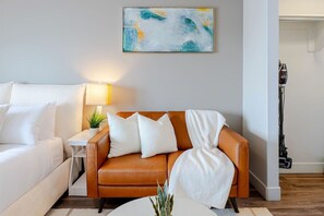 Stylish studio space with queen bed and luxury mattress, luxury sofa and walk-in wardrobe
