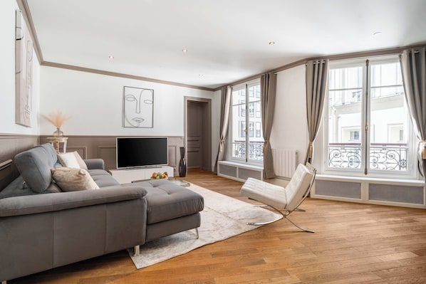 Spacious and stylish, the living room invites you to unwind in comfort