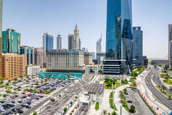 Panoramic City View: Experience Dubai's skyline from your window, vibrant and bustling below!